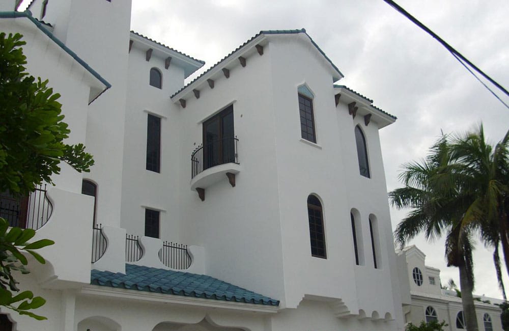 Stucco wall maintenance detail on a Florida home exterior